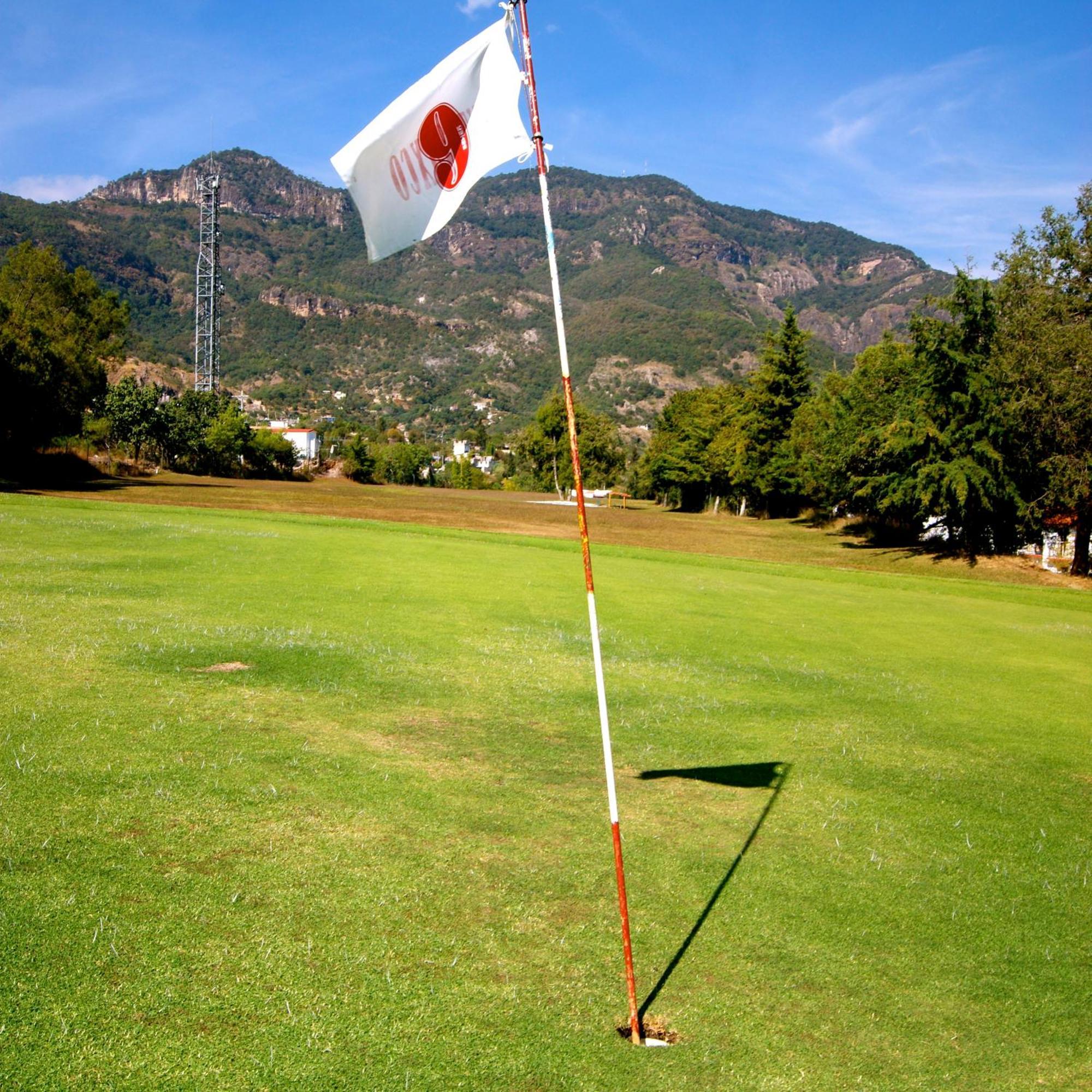 Hotel Montetaxco Exteriér fotografie The flag of the host country is placed on the corner of the field.